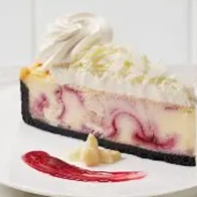 WHITE CHOCOLATE RASPBERRY CHEESECAKE.